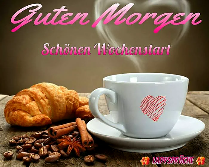 Eine dampfende weiße Kaffeetasse mit einem roten Herz auf Untertasse, daneben ein goldbraunes Croissant, geröstete Kaffeebohnen, Zimtstangen und Sternanis auf rustikalem Holztisch. Eine warme Morgenstimmung verbreitet sich.