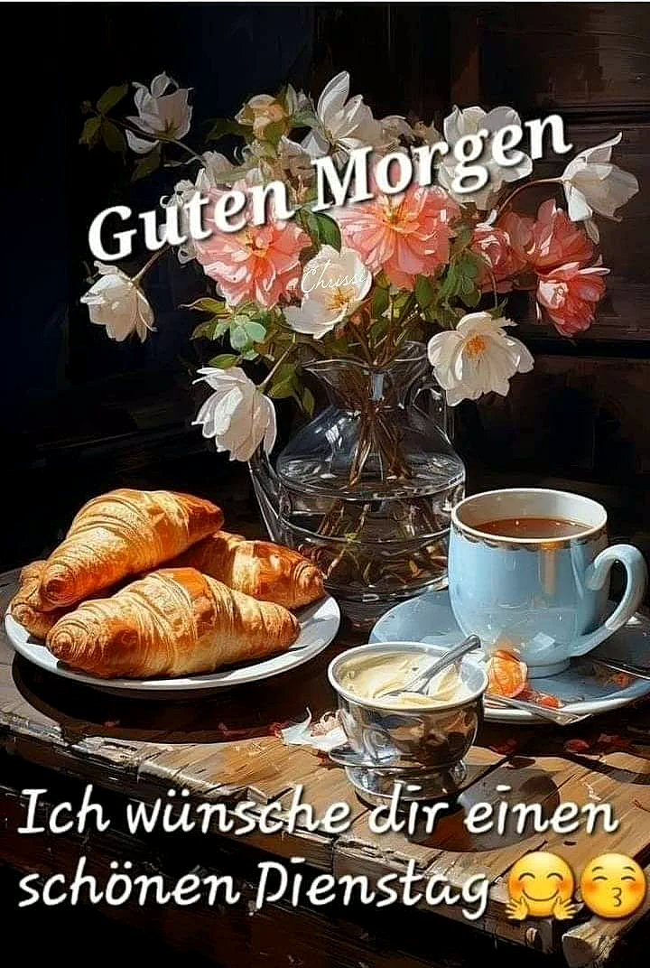 Ein Stillleben auf einem Holztisch präsentiert frische Croissants, eine dampfende Kaffeetasse und einen Blumenstrauß. Die Szene vermittelt eine ruhige, einladende Morgenstimmung für einen fokussierten Dienstag.