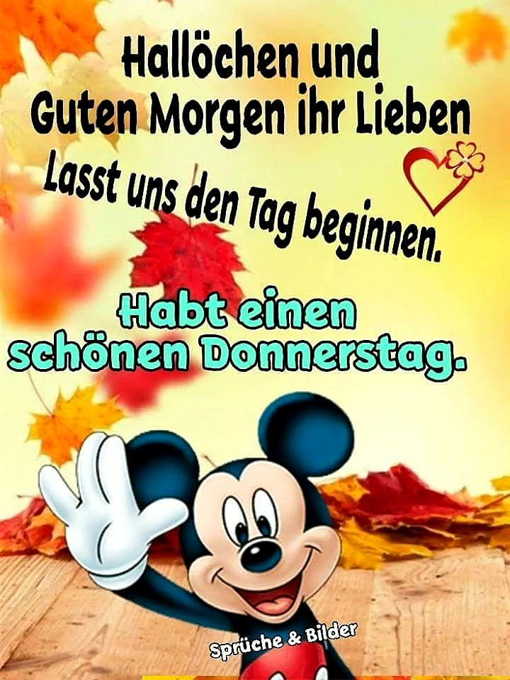 Ein farbenfrohes Bild mit Mickey Mouse, der auf einem Holzfußboden sitzt und eine freundliche Geste macht. Im Hintergrund sind Herbstblätter in orange, gelb und rot zu sehen. Der Text 'Hallöchen und Guten Morgen ihr Lieben. Lasst uns den Tag beginnen. Habt einen schönen Donnerstag.' ist in schwarzer und türkisfarbener Schrift über dem Bild platziert.