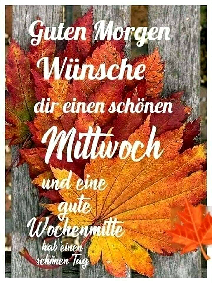 Ein Foto von einem Holzstamm mit Herbstlaub in den Farben Rot, Orange und Gelb. Der Text 'Guten Morgen Wünsche dir einen schönen Mittwoch und eine gute Wochenmitte hab einen schönen Tag' ist in weißer Schrift über das Bild gelegt.