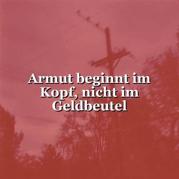 Ein rotes Spruchbild mit dem Zitat: 'Armut beginnt im Kopf, nicht im Geldbeutel'. Verschwommene Umrisse eines Strommastes und Bäume im Hintergrund verstärken die ernste Stimmung.