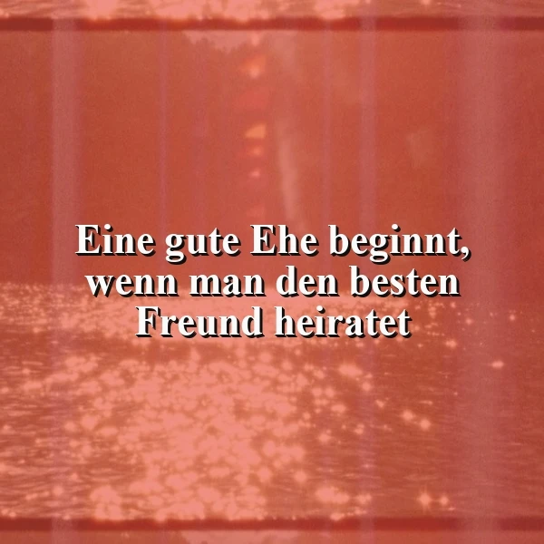 Ein romantisches, warmes Bild mit einer Textüberlagerung. Der Hintergrund zeigt eine unscharfe, rötliche Szene mit Lichtreflexen, die eine intime Atmosphäre schaffen. Der Text 'Eine gute Ehe beginnt, wenn man den besten Freund heiratet' ist zentral und deutlich lesbar.