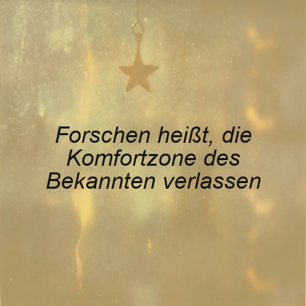 Ein goldenes Hintergrundbild mit einem Stern, der an einem Faden hängt. Der Text 'Forschen heißt, die Komfortzone des Bekannten verlassen' ist in schwarzer Schrift über das Bild gelegt.